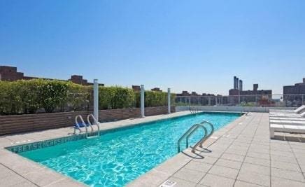 community pool featuring fence