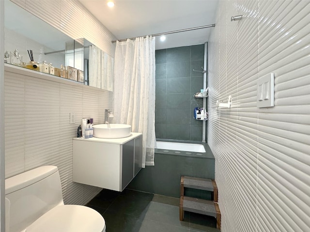 425 E 13th St Unit 1J, New York Manhattan, NY 10009 - bathroom featuring tile walls, tile patterned flooring, toilet, shower / tub combo with curtain, and vanity