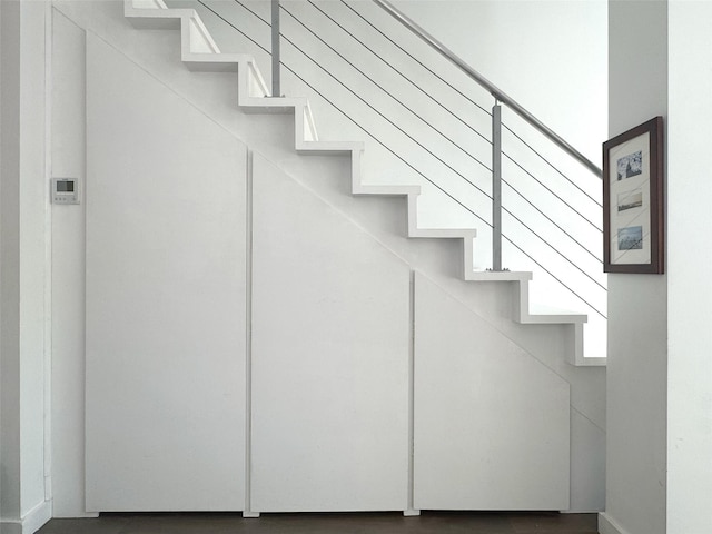 425 E 13th St Unit 1J, New York Manhattan, NY 10009 - stairway featuring baseboards