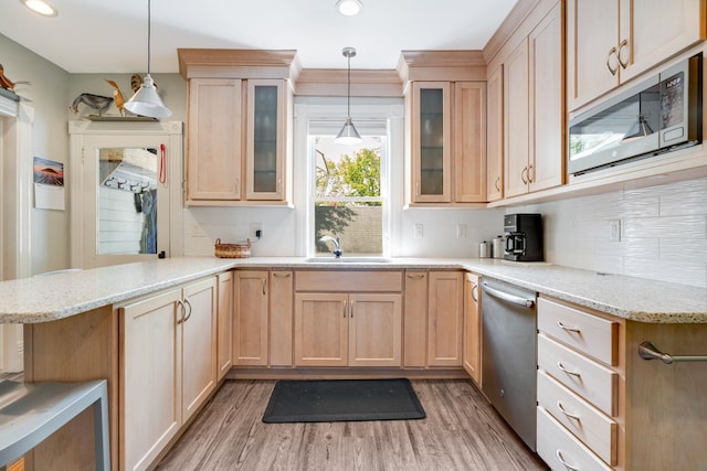 4 Oak St, Cold Spring, NY 10516 - kitchen with appliances with stainless steel finishes, light brown cabinetry, light wood finished floors, a peninsula, and recessed lighting