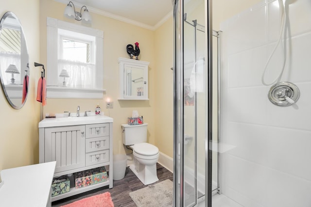 4 Oak St, Cold Spring, NY 10516 - bathroom featuring a stall shower, ornamental molding, wood finished floors, toilet, and vanity
