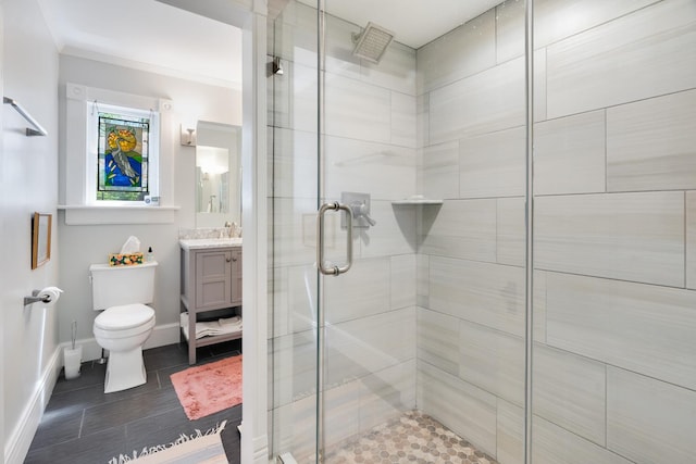 4 Oak St, Cold Spring, NY 10516 - full bath with a shower stall, toilet, vanity, baseboards, and crown molding