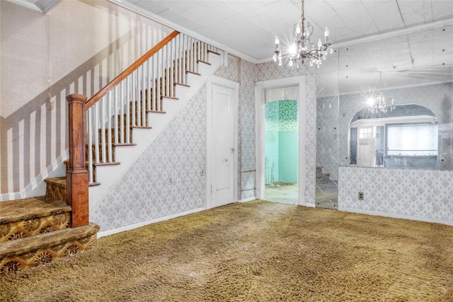 1804 New York Ave, Brooklyn, NY 11210 - unfurnished living room with wallpapered walls, ornamental molding, carpet floors, a chandelier, and stairs
