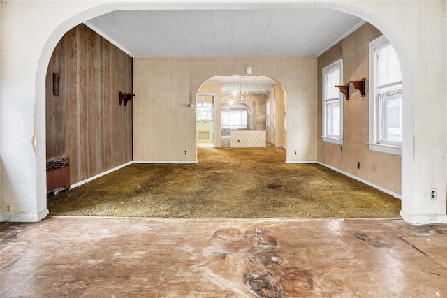 1804 New York Ave, Brooklyn, NY 11210 - empty room with plenty of natural light, arched walkways, baseboards, and crown molding