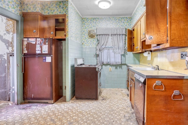 1804 New York Ave, Brooklyn, NY 11210 - kitchen featuring wallpapered walls, appliances with stainless steel finishes, brown cabinetry, light countertops, and a sink
