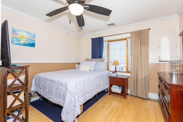 bedroom with light wood-type flooring, ornamental molding, a baseboard radiator, baseboards, and a ceiling fan