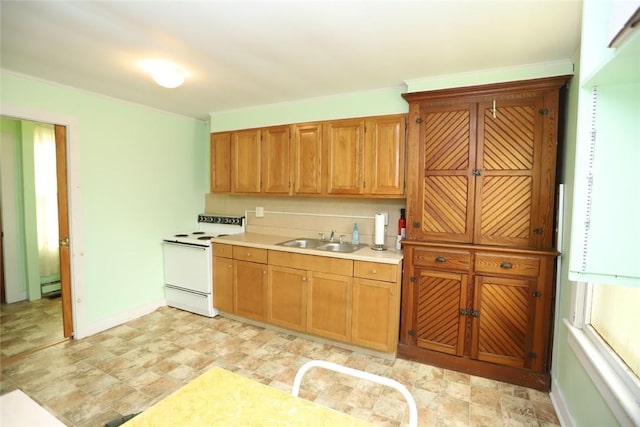 14 Hankins Rd, Hankins, NY 12741 - kitchen featuring white range with electric stovetop, a sink, light countertops, brown cabinetry, and baseboards