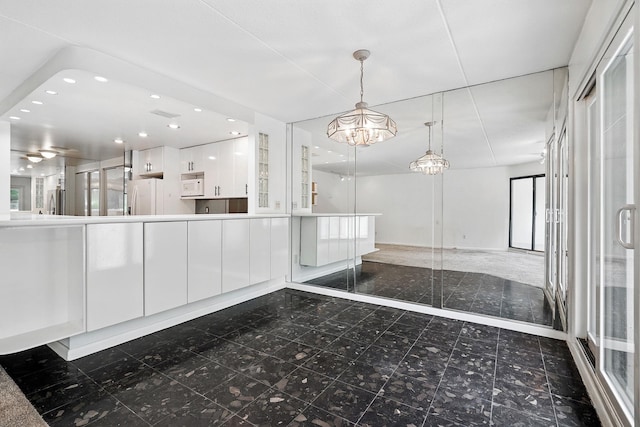 300 High Point Dr Unit 313, Hartsdale, NY 10530 - unfurnished dining area featuring a chandelier, recessed lighting, and baseboards