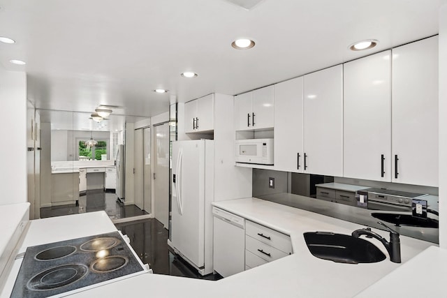 300 High Point Dr Unit 313, Hartsdale, NY 10530 - kitchen featuring white appliances, a sink, white cabinetry, recessed lighting, and light countertops