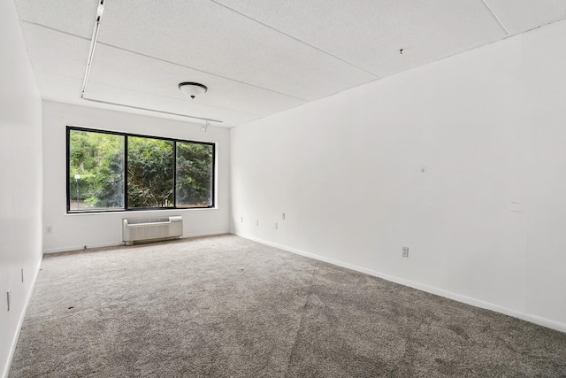 300 High Point Dr Unit 313, Hartsdale, NY 10530 - empty room with a wall mounted AC, carpet, and baseboards
