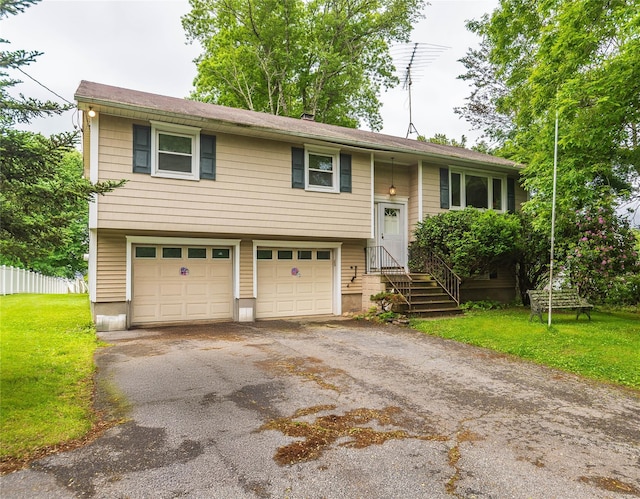 3042 Gomer St, Yorktown Heights, NY 10598 - raised ranch featuring a garage and asphalt driveway