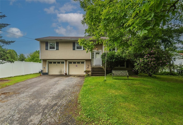 3042 Gomer St, Yorktown Heights, NY 10598 - bi-level home with asphalt driveway and a garage