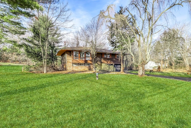 view of front of house with a front lawn and stone siding