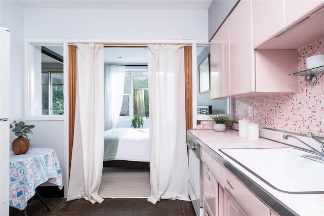 1 Salisbury Pt Unit 6C, Nyack, NY 10960 - kitchen with a sink, light countertops, healthy amount of natural light, and backsplash