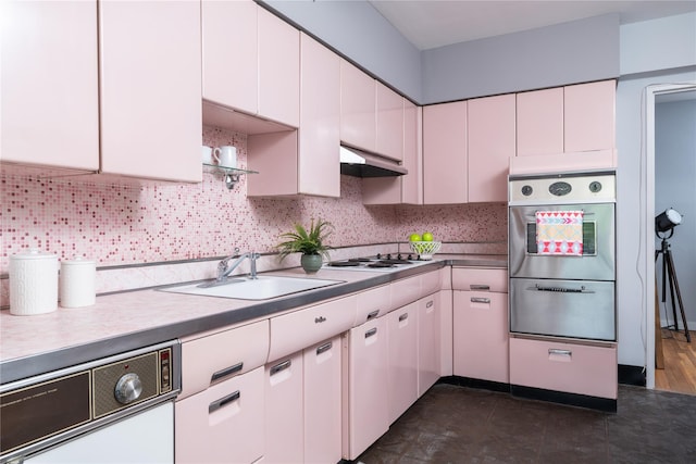 1 Salisbury Pt Unit 6C, Nyack, NY 10960 - kitchen with stainless steel oven, a sink, white stovetop, under cabinet range hood, and dishwasher