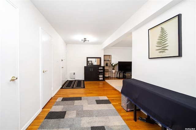 corridor featuring light wood-style flooring