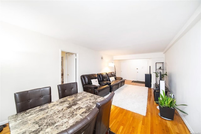 dining room with light wood-style flooring