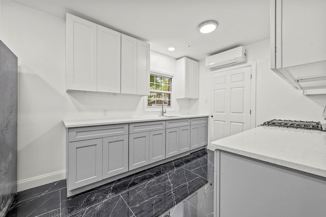 166-03 69th Ave, Fresh Meadows, NY 11366 - kitchen with a wall mounted air conditioner, baseboards, dark marble finish flooring, a sink, and recessed lighting