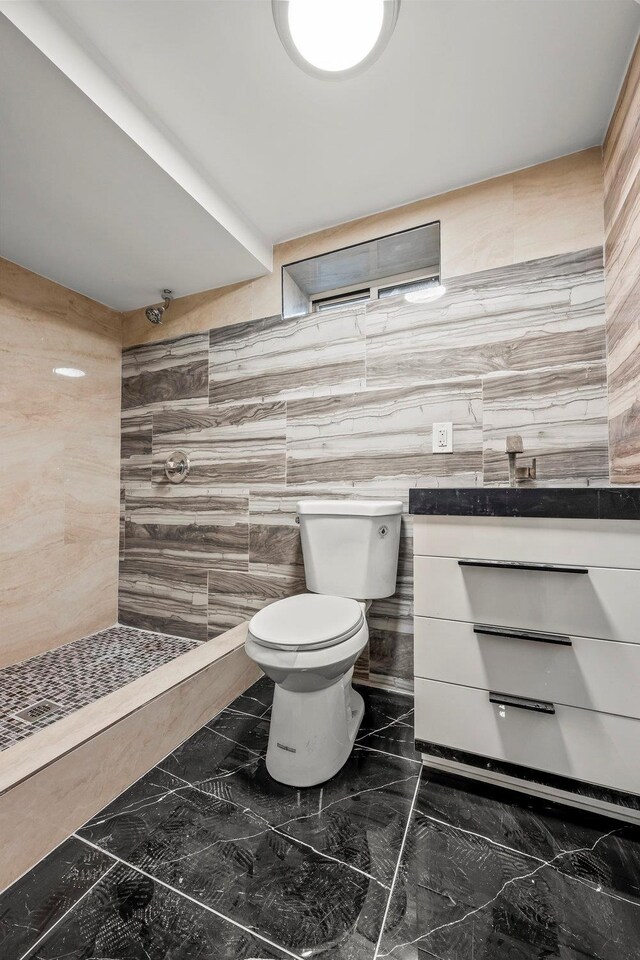 166-03 69th Ave, Fresh Meadows, NY 11366 - full bath with marble tiled floors, tiled shower, toilet, and tile walls