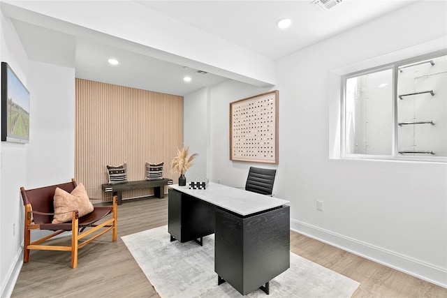 office area featuring baseboards, light wood finished floors, and recessed lighting