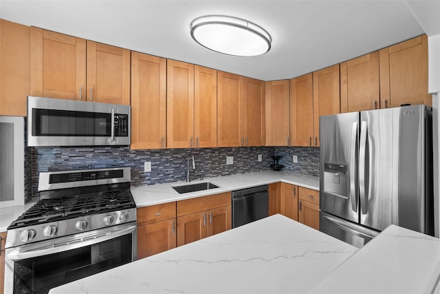 1271 California Rd Unit 1L, Eastchester, NY 10709 - kitchen with appliances with stainless steel finishes, a sink, tasteful backsplash, and light stone counters