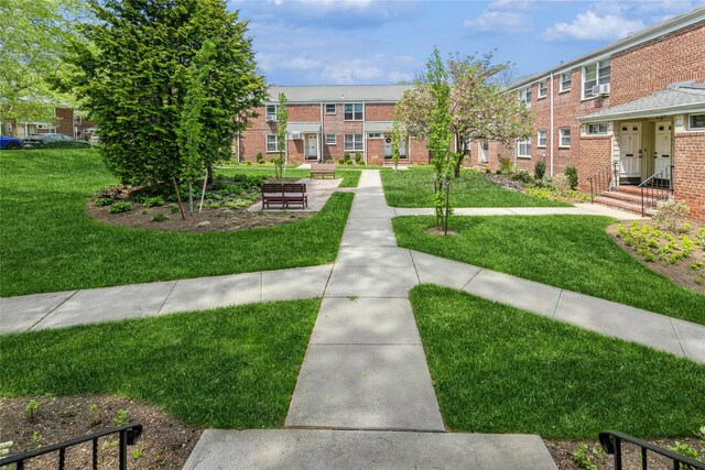 surrounding community featuring a yard and a residential view