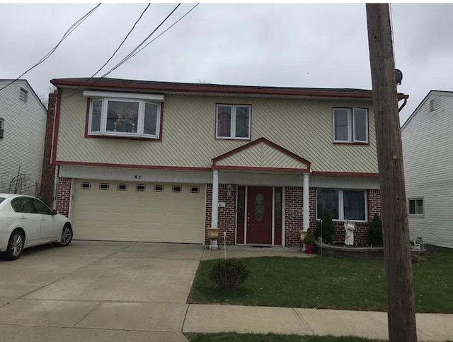 61 Morton Ave, Freeport, NY 11520 - view of front of property featuring brick siding, a garage, driveway, and a front lawn