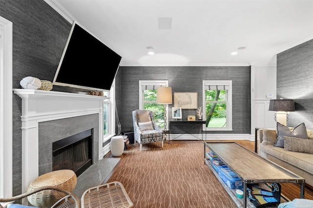 394 Mill Rd, Westhampton, NY 11977 - living area featuring a fireplace, wallpapered walls, wood finished floors, crown molding, and baseboards