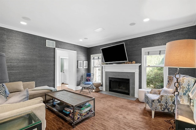 394 Mill Rd, Westhampton, NY 11977 - living room featuring ornamental molding, a fireplace with raised hearth, wallpapered walls, recessed lighting, and baseboards