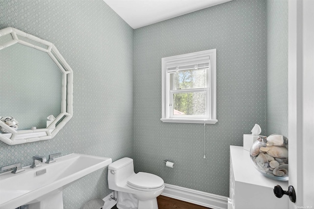 394 Mill Rd, Westhampton, NY 11977 - bathroom featuring a sink, toilet, wood finished floors, and baseboards