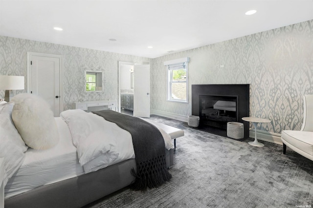 394 Mill Rd, Westhampton, NY 11977 - bedroom featuring wallpapered walls, a fireplace with flush hearth, baseboards, recessed lighting, and carpet