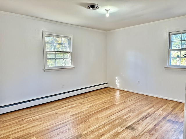 unfurnished room featuring a baseboard radiator, light wood-style floors, ornamental molding, and baseboards