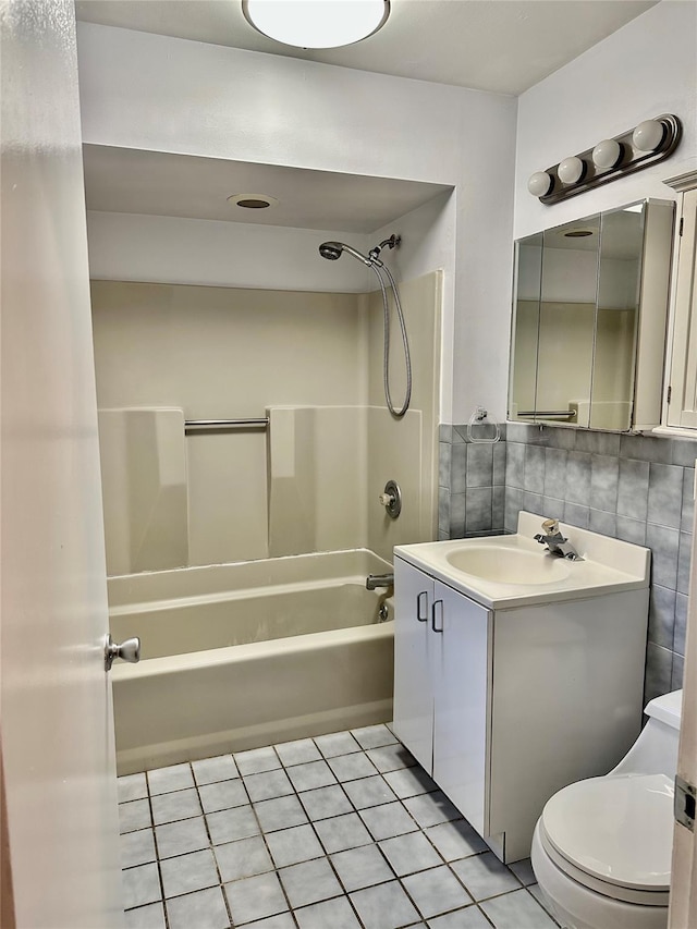 bathroom with tile patterned flooring,  shower combination, vanity, toilet, and decorative backsplash