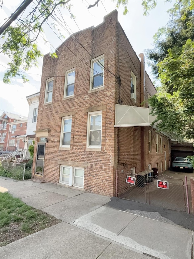 view of front of home featuring brick siding