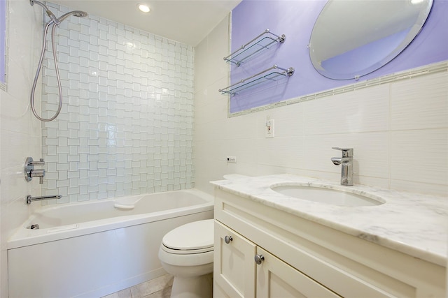 bathroom featuring tile walls, toilet, shower / washtub combination, vanity, and recessed lighting