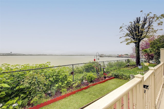 balcony featuring a water view