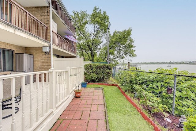 balcony featuring a water view