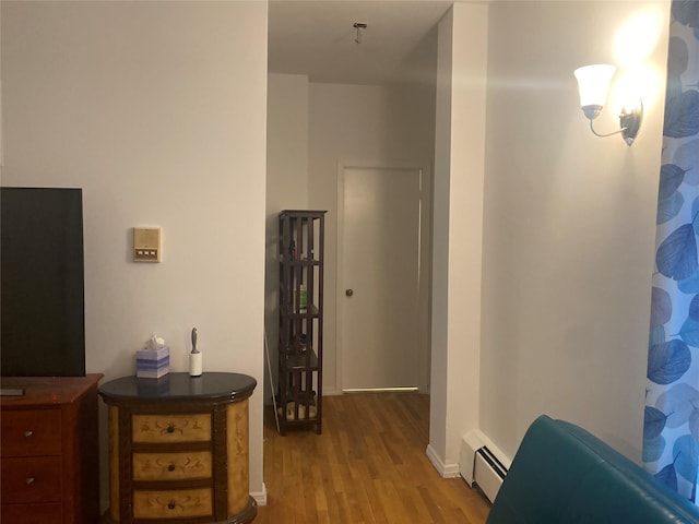 8410 101st St Unit 3U, Richmond Hill, NY 11418 - hallway with a baseboard radiator and wood finished floors
