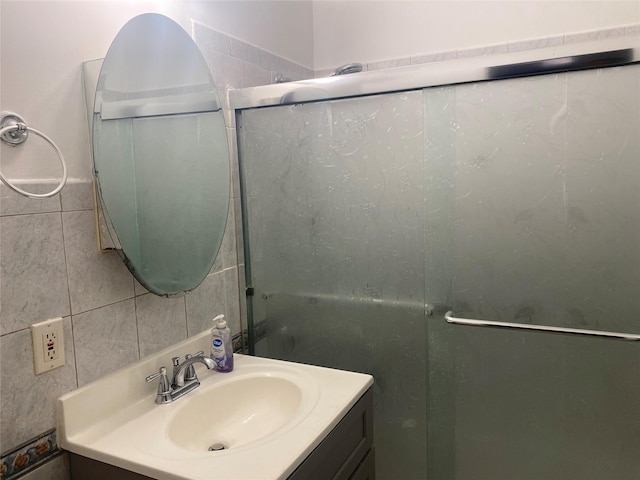 8410 101st St Unit 3U, Richmond Hill, NY 11418 - bathroom with vanity, tile walls, and an enclosed shower
