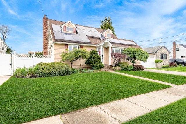 new england style home featuring solar panels, a chimney, and a gate