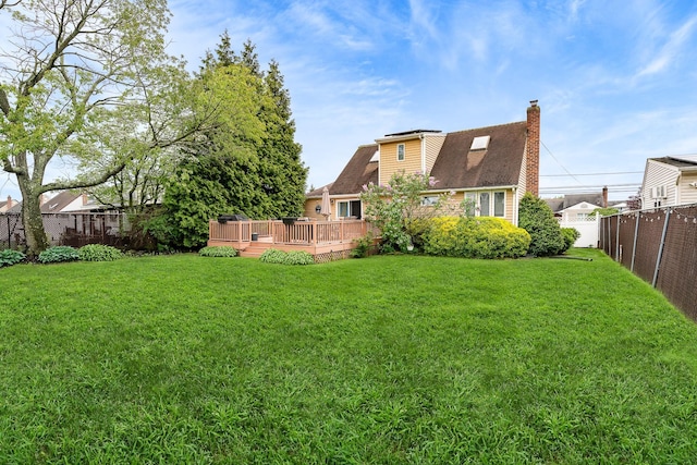 view of yard with a wooden deck