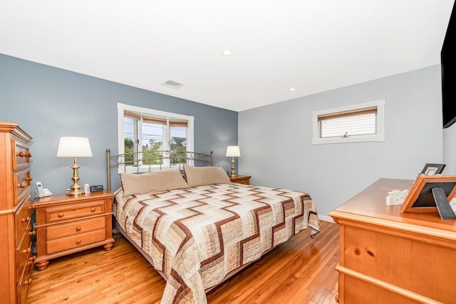 bedroom with light wood-type flooring and recessed lighting