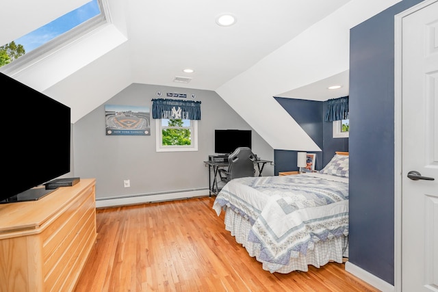bedroom with a baseboard radiator, wood finished floors, lofted ceiling, an office area, and recessed lighting
