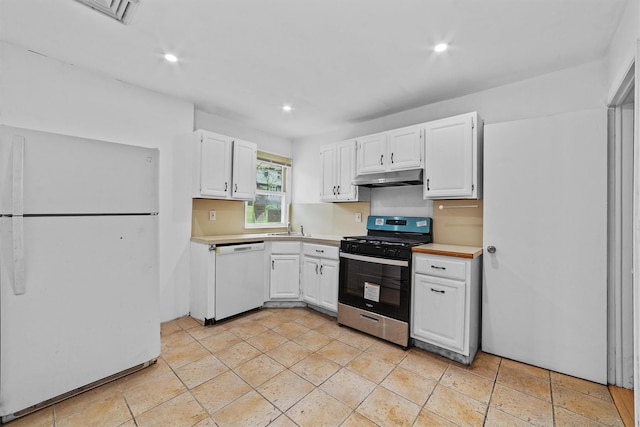 16 S Lawrence Ave, Elmsford, NY 10523 - kitchen featuring white appliances, under cabinet range hood, light countertops, white cabinetry, and recessed lighting