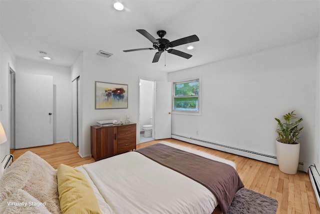 16 S Lawrence Ave, Elmsford, NY 10523 - bedroom featuring baseboard heating, light wood-style flooring, ensuite bathroom, recessed lighting, and a baseboard radiator