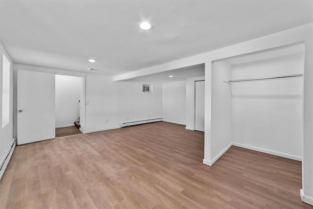 16 S Lawrence Ave, Elmsford, NY 10523 - finished below grade area featuring a baseboard heating unit, recessed lighting, light wood-type flooring, and baseboards