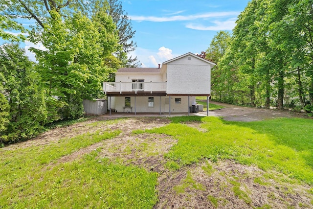 16 S Lawrence Ave, Elmsford, NY 10523 - back of property with a wooden deck, central AC, a patio, and a yard