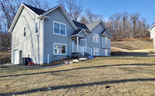 27 Catskill High Rail, Monroe, NY 10950 - view of front facade with a garage, a front lawn, and cooling unit