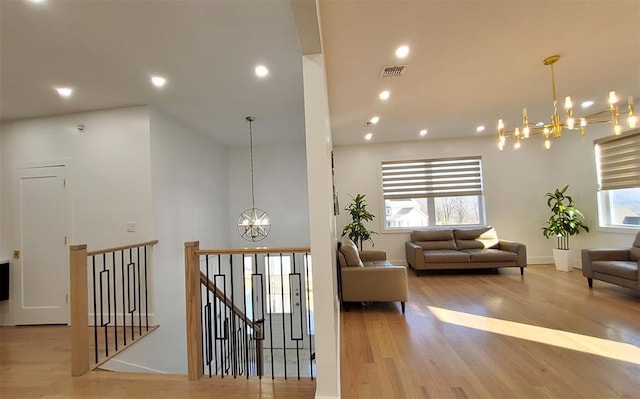 27 Catskill High Rail, Monroe, NY 10950 - corridor with a chandelier, an upstairs landing, wood finished floors, recessed lighting, and baseboards