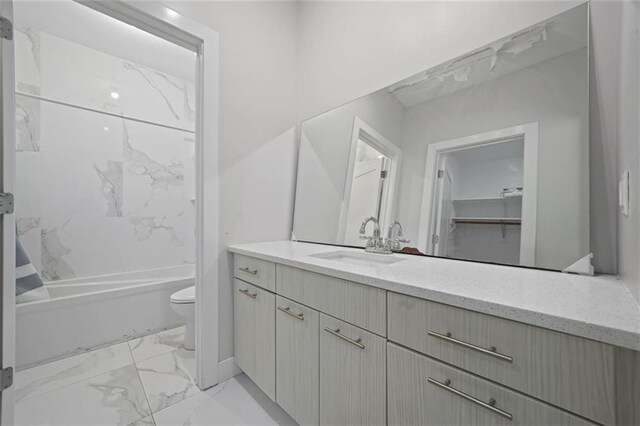 27 Catskill High Rail, Monroe, NY 10950 - full bathroom featuring marble look tiles, toilet, vanity, and shower / tub combination